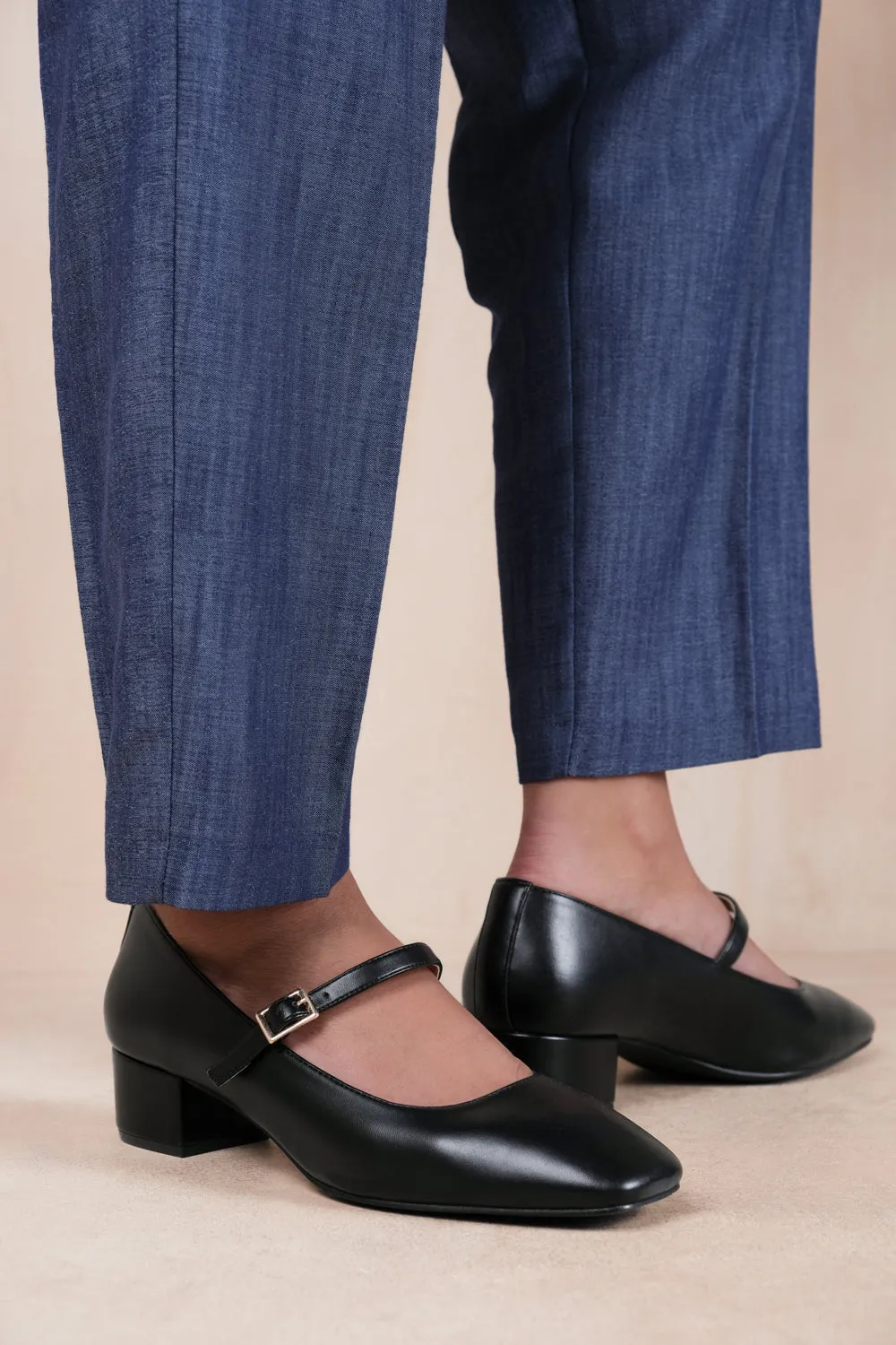 OSLO LOW BLOCK HEEL WITH STRAP AND SQUARE TOE IN BLACK FAUX LEATHER