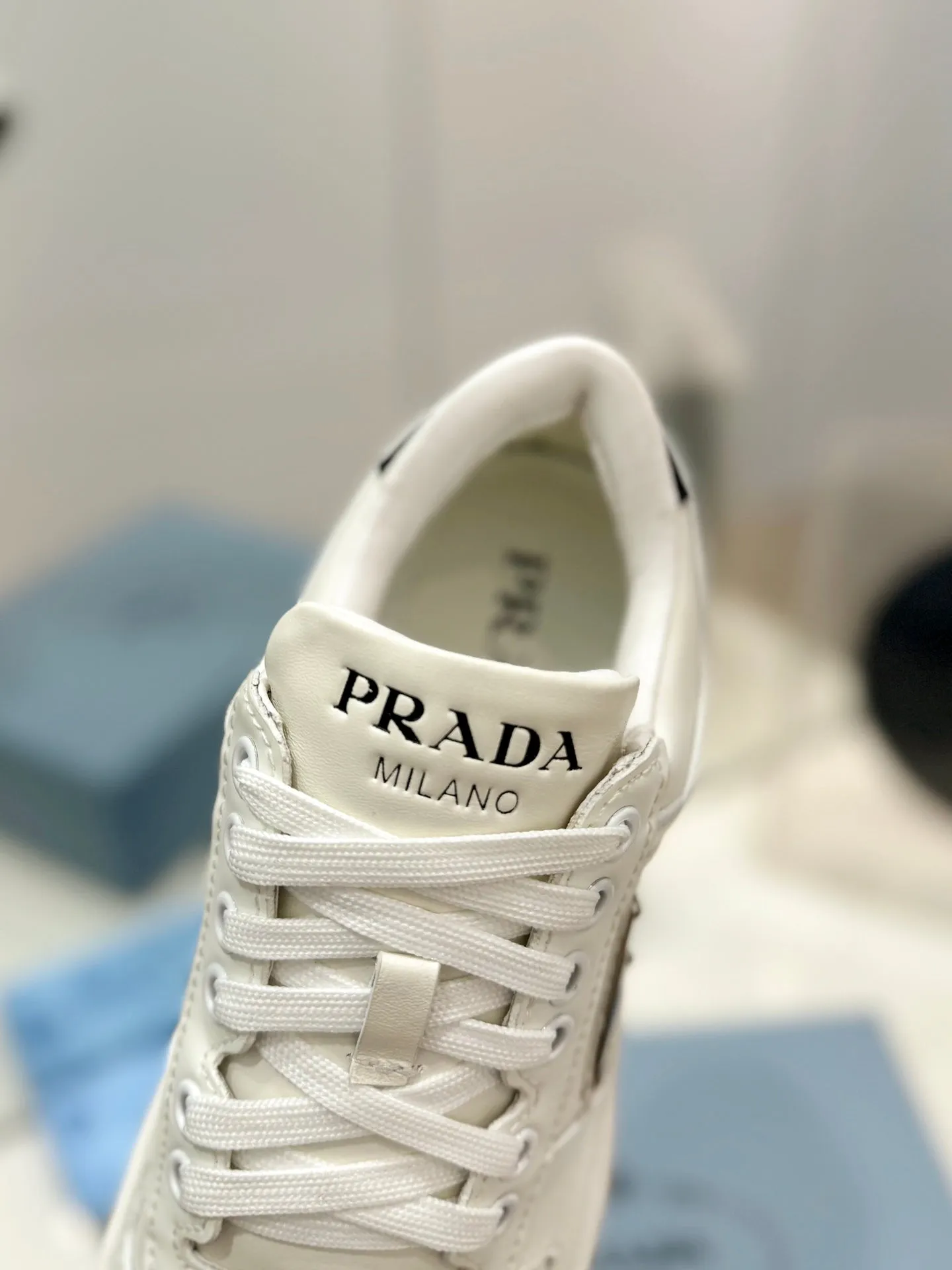 PRA DOWNTOWN PERFORATED SNEAKERS WHITE AND BLACK LOGO CALFSKIN