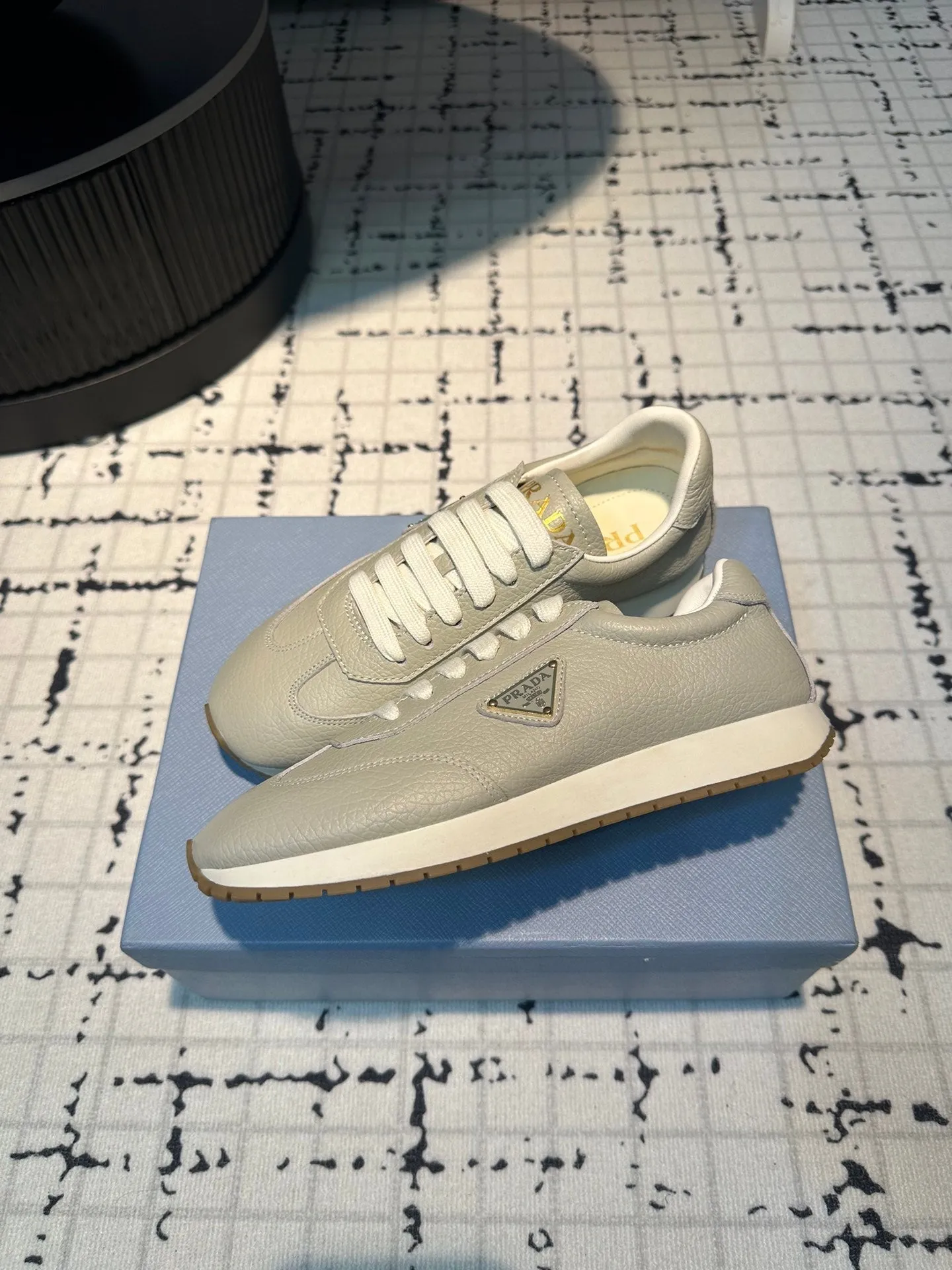 PRA TRIANGLE LOGO SNEAKERS LIGHT GRAY CALFSKIN